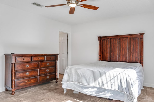 bedroom with ceiling fan and light hardwood / wood-style flooring