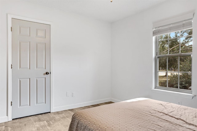 bedroom with light wood-type flooring