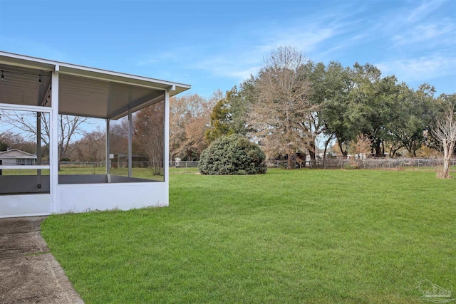 view of yard featuring a sunroom