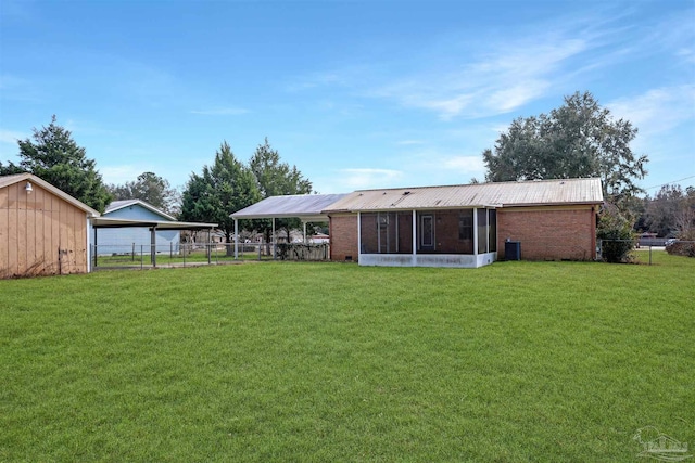 view of yard with a sunroom