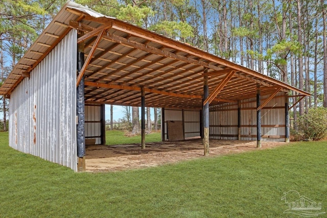 view of outbuilding featuring a yard