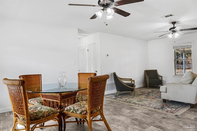 dining room featuring ceiling fan and hardwood / wood-style floors