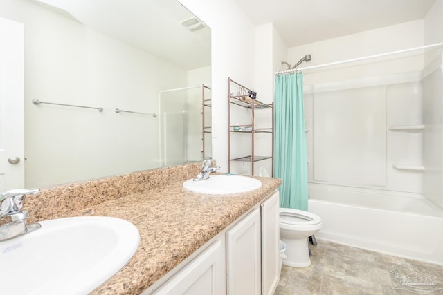 full bath featuring a sink, toilet, double vanity, and shower / tub combo