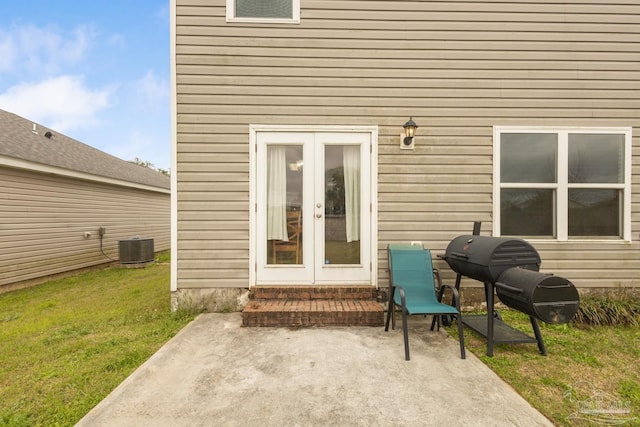 view of patio / terrace with entry steps, cooling unit, french doors, and a grill