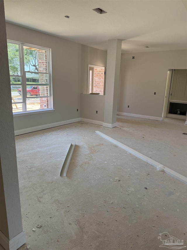 spare room featuring baseboards