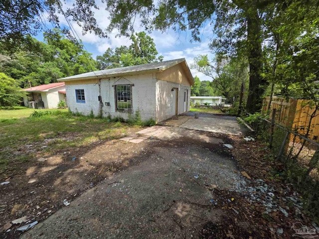 420 Forrest St, Cantonment, FL 32533 - exterior space featuring concrete block siding