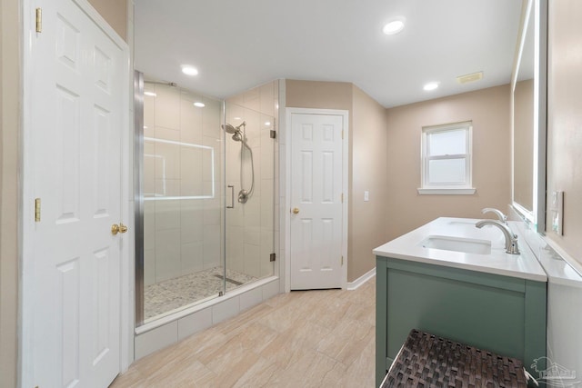 1052 Ashley Rd, Milton, FL 32583 - bathroom with a shower stall, vanity, baseboards, and recessed lighting