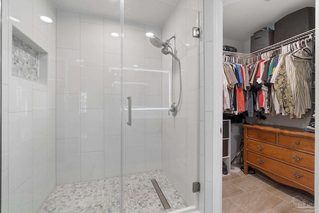 1052 Ashley Rd, Milton, FL 32583 - bathroom with a walk in closet and a stall shower