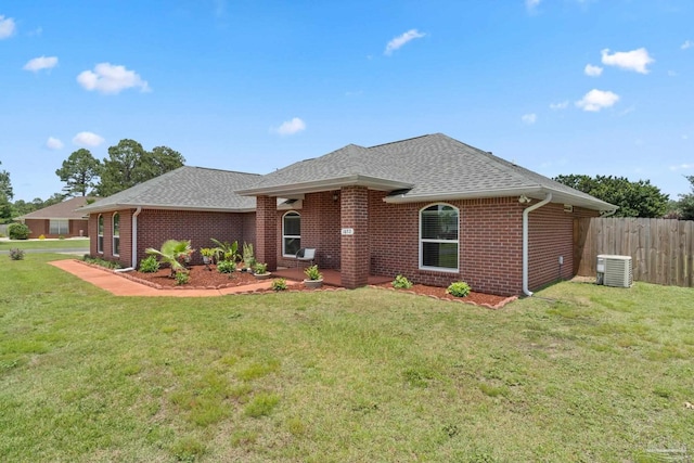 1052 Ashley Rd, Milton, FL 32583 - ranch-style home featuring brick siding, roof with shingles, and central air condition unit