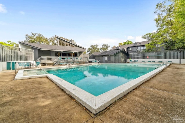 view of swimming pool with a patio area