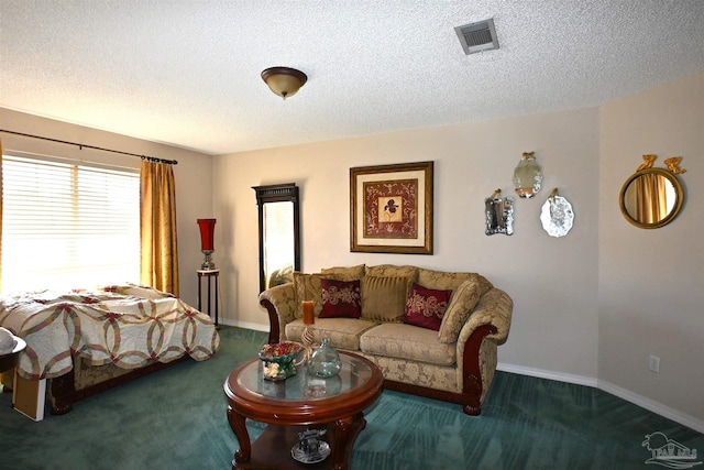 carpeted living room with a textured ceiling