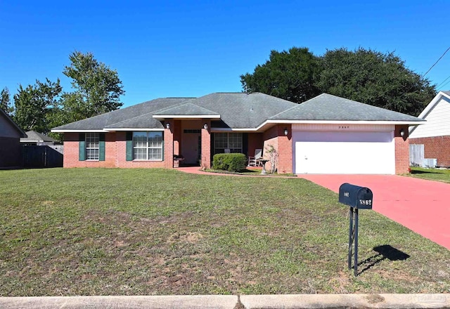 ranch-style home with a front yard and a garage