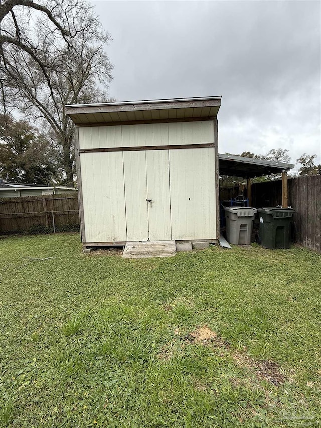 view of shed with fence