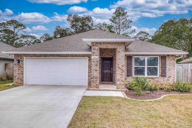 view of front of home with a garage and a front lawn