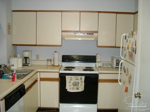 kitchen featuring white appliances, wall chimney exhaust hood, and sink