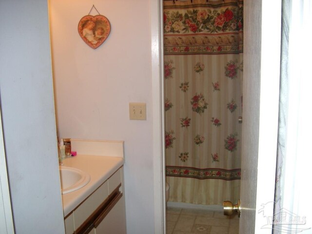 bathroom with vanity and tile patterned flooring