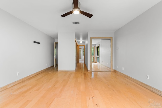 unfurnished bedroom with visible vents, a ceiling fan, a closet, light wood-style floors, and baseboards