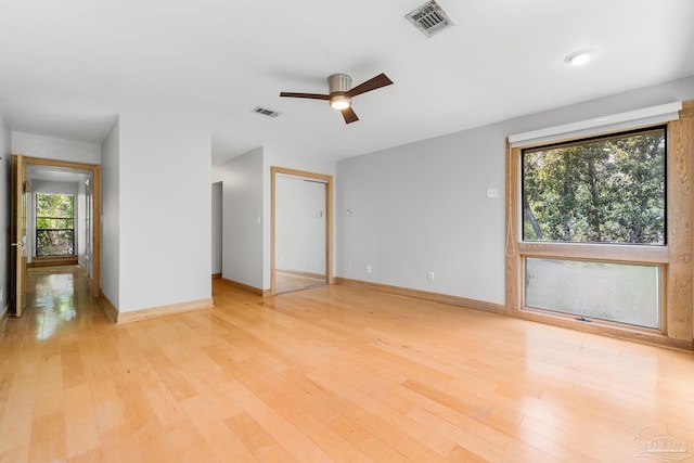 unfurnished bedroom featuring baseboards, visible vents, and light wood-type flooring