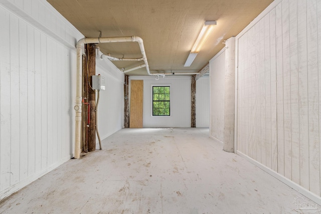 garage featuring wooden walls