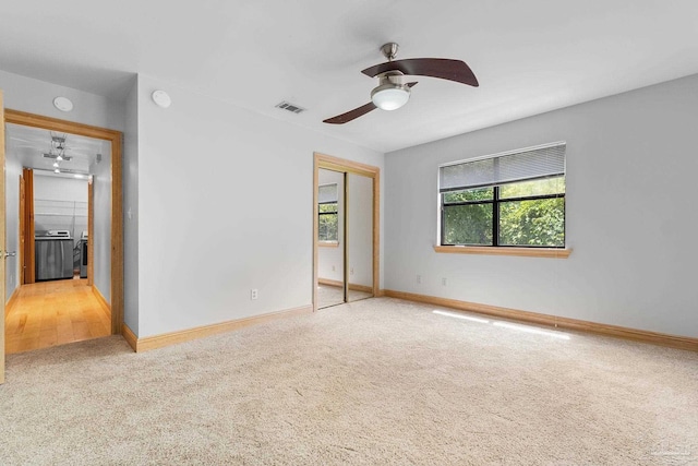 spare room featuring visible vents, baseboards, and carpet floors