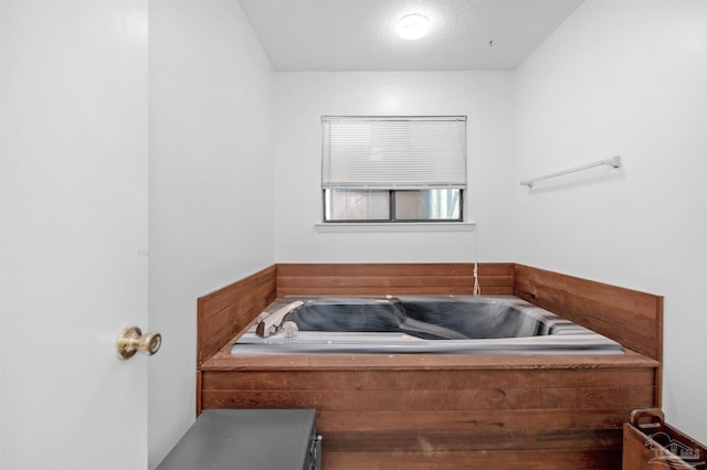bathroom with a garden tub