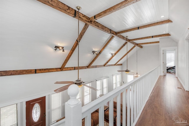 room details featuring wood finished floors, beam ceiling, and ceiling fan