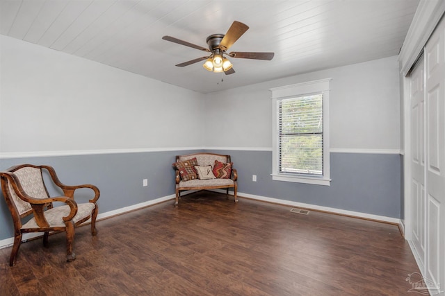 living area with wood ceiling, baseboards, ceiling fan, and wood finished floors