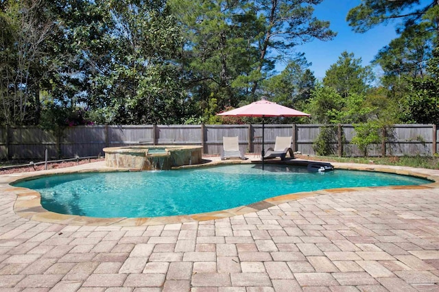 view of swimming pool with a fenced in pool, an in ground hot tub, a patio, and fence private yard