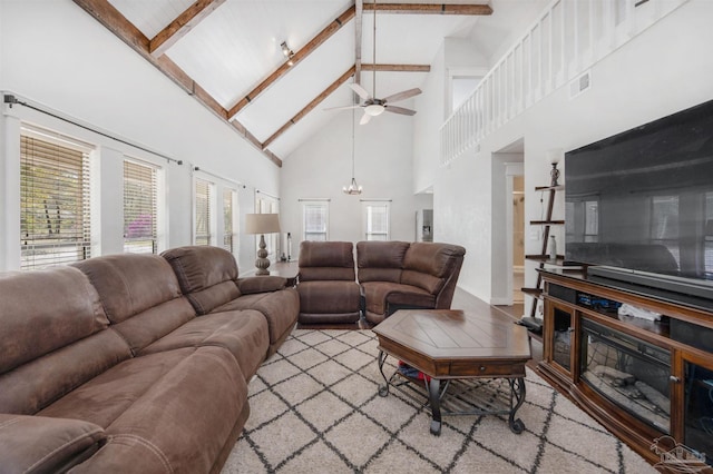 living room featuring visible vents, high vaulted ceiling, beam ceiling, and ceiling fan
