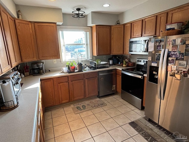 kitchen with stainless steel appliances and light tile patterned floors