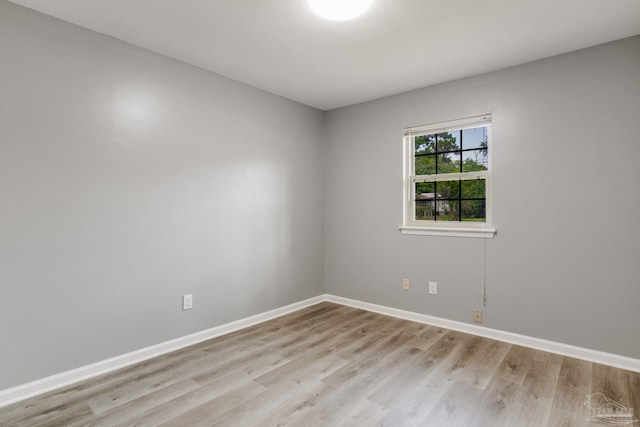 spare room with hardwood / wood-style flooring