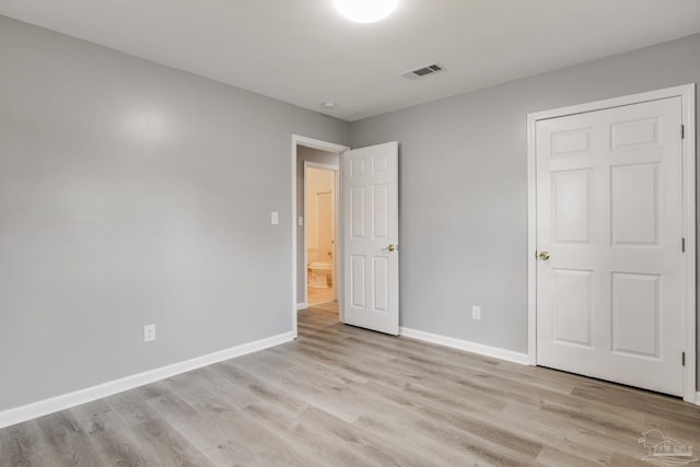 unfurnished bedroom featuring light wood-type flooring