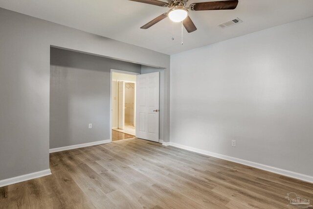 spare room with ceiling fan and light hardwood / wood-style floors