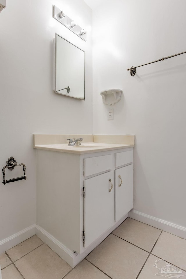 bathroom featuring tile patterned flooring and vanity