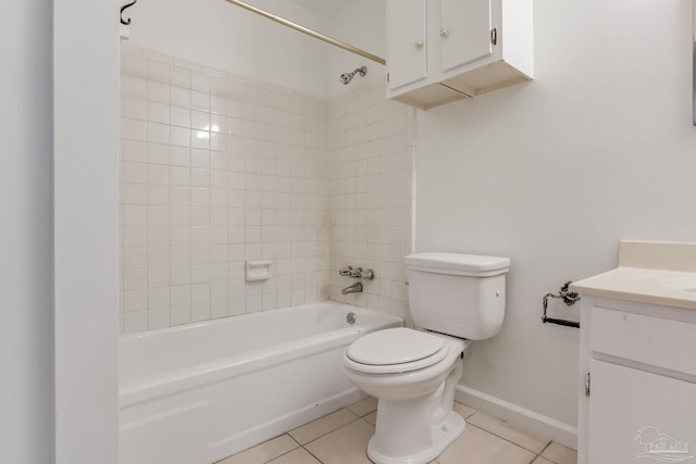 full bathroom featuring tiled shower / bath, toilet, tile patterned floors, and vanity