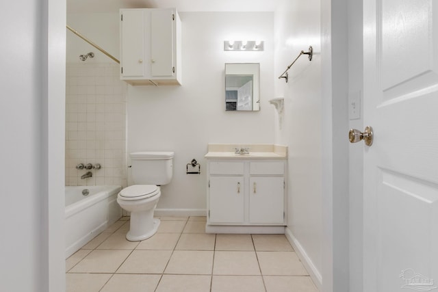 full bathroom with toilet, tiled shower / bath, vanity, and tile patterned floors