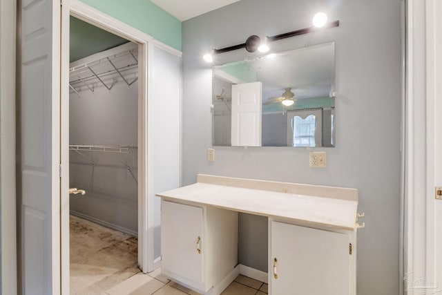 bathroom with ceiling fan, tile patterned flooring, and vanity