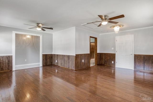 empty room with ceiling fan, ornamental molding, and wood-type flooring