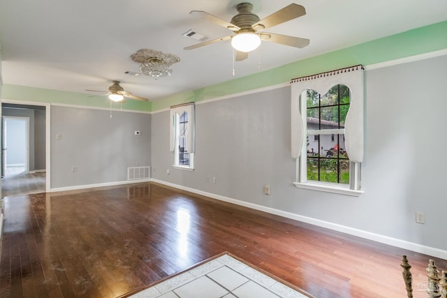 spare room featuring ceiling fan and hardwood / wood-style flooring