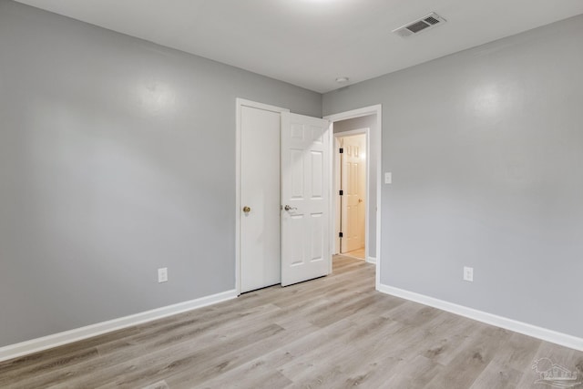 spare room with light hardwood / wood-style floors