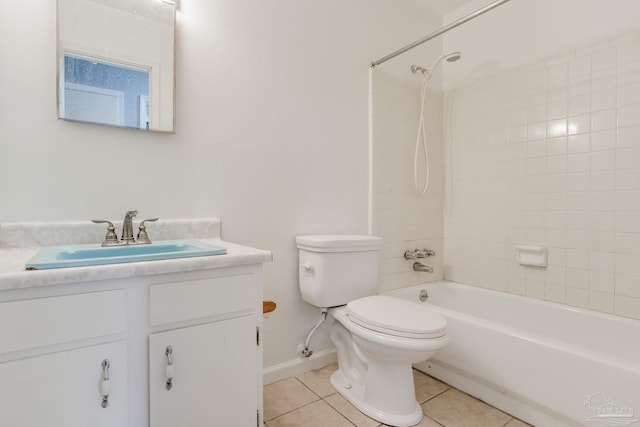 full bathroom with tiled shower / bath combo, tile patterned flooring, toilet, and vanity