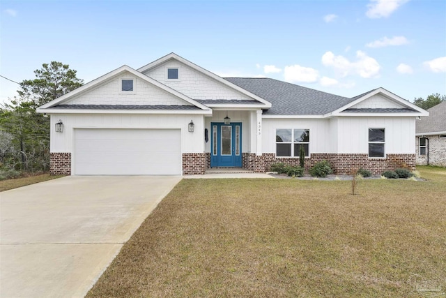 view of front of house featuring a garage and a front lawn