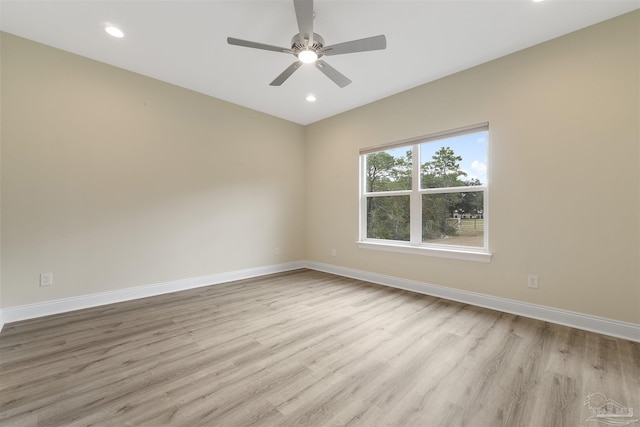 unfurnished room featuring light wood-type flooring and ceiling fan