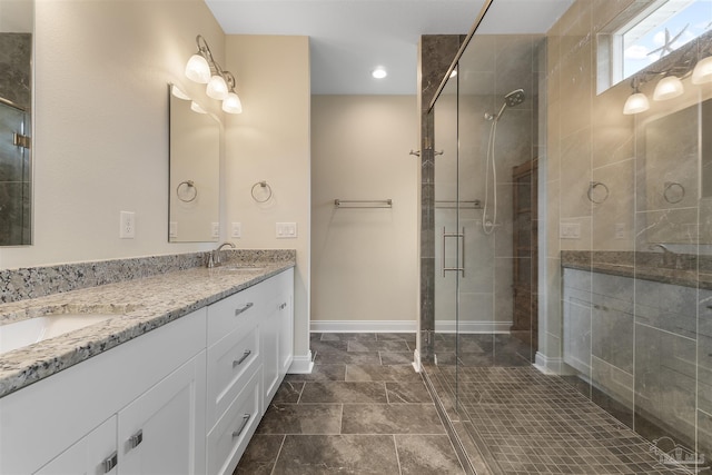 bathroom featuring vanity and a shower with shower door