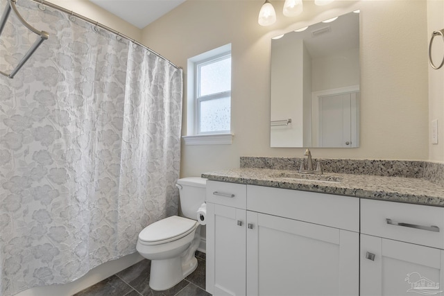 bathroom with toilet and vanity