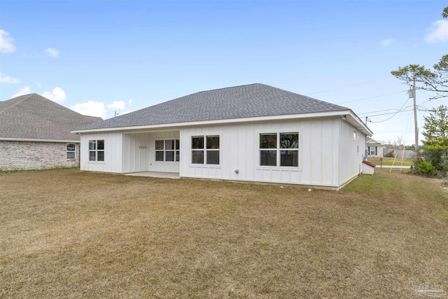 back of house with a lawn and a patio area