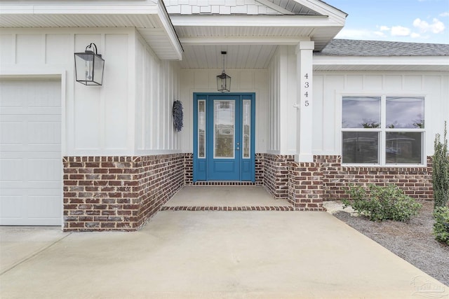 doorway to property featuring a garage