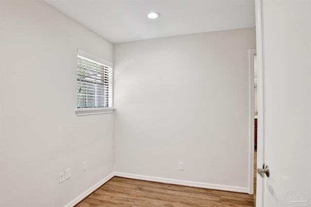 1118 Tall Pine Trl, Gulf Breeze, FL 32561 - spare room with baseboards, light wood-type flooring, and recessed lighting