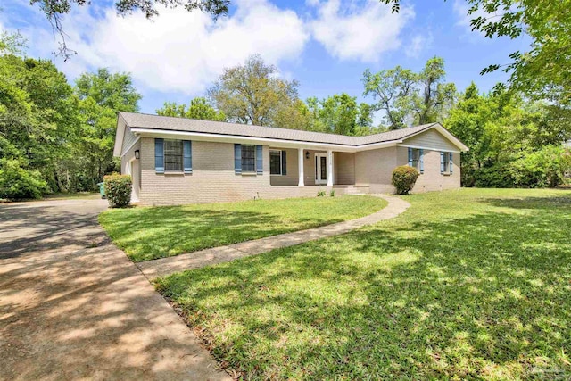 1118 Tall Pine Trl, Gulf Breeze, FL 32561 - single story home featuring brick siding, a front lawn, and concrete driveway