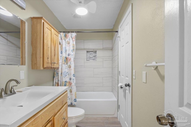 full bathroom featuring vanity, toilet, and shower / tub combo with curtain